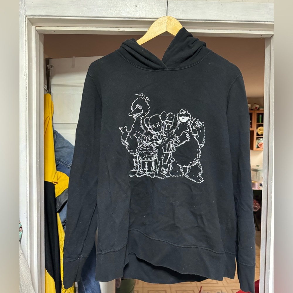 Uniqlo Black Hoodie with KAWS Sesame Street Tag